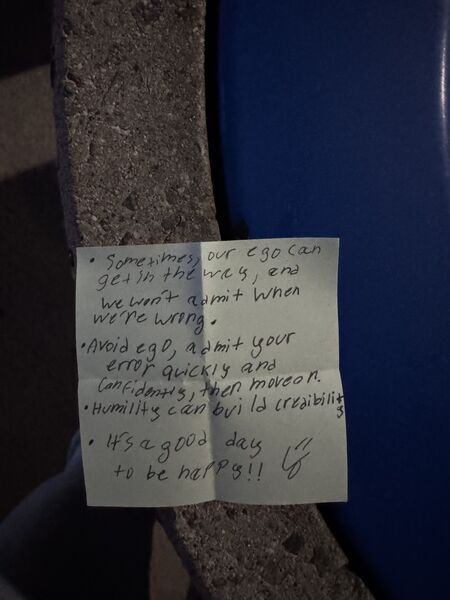 Handwritten sticky note with words of encouragement